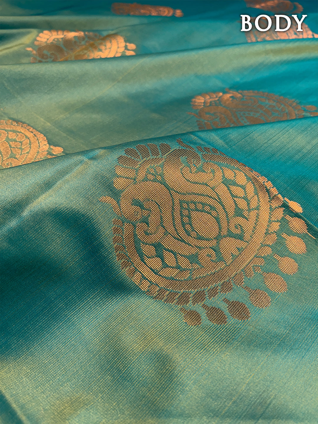 Dual color of turquoise green and maroon kanchipuram semi soft silk saree