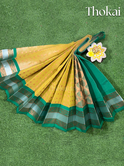 Yellow and green tissue semi silk saree