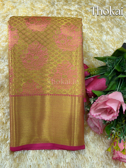 Dual color of pink and gold muhurtham silk saree