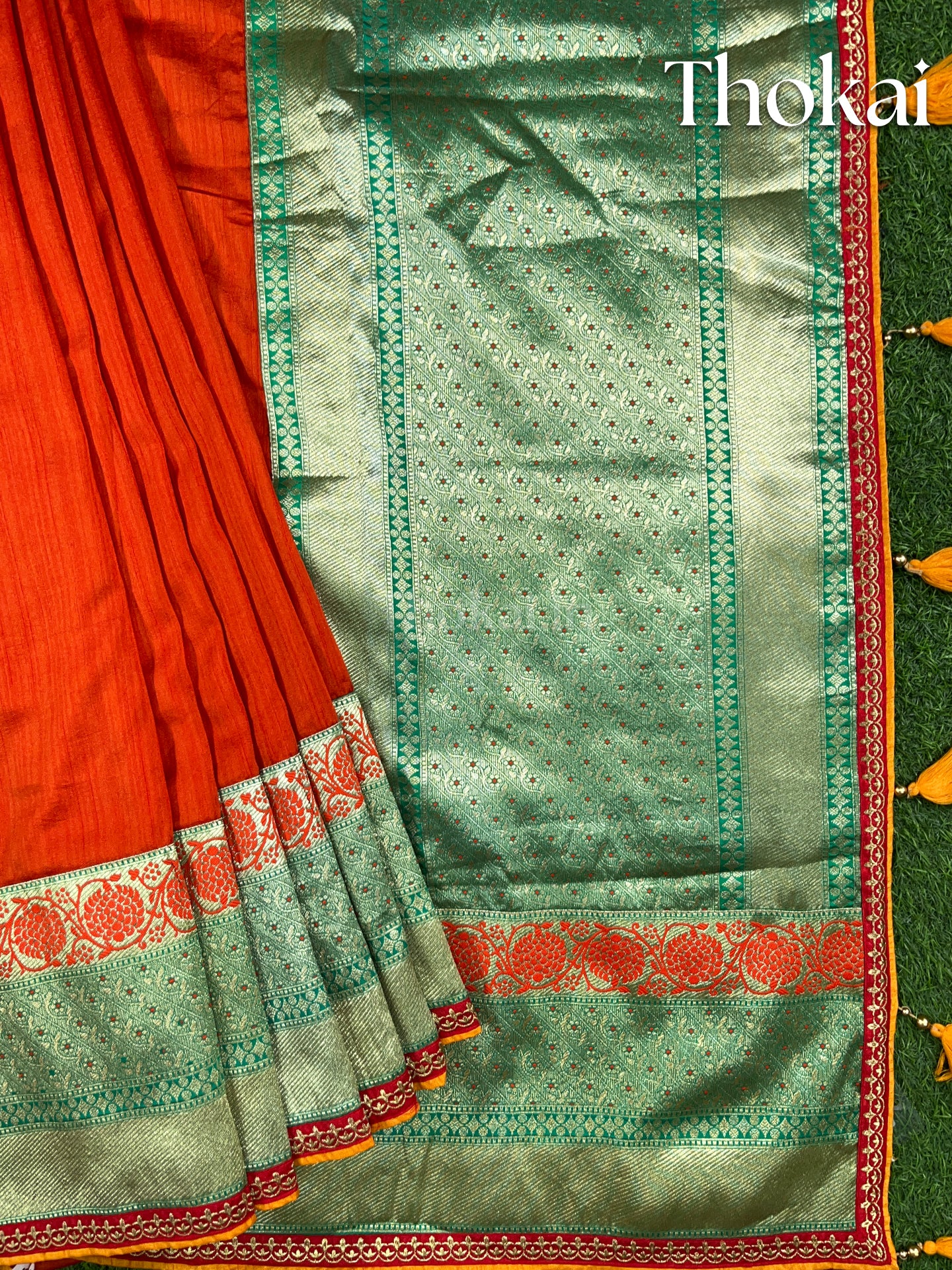 Orange and green raw silk saree