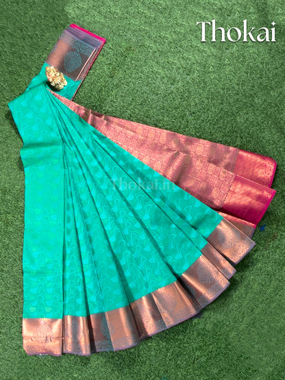 Dual shade of turquoise and beet red semi silk saree