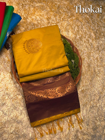 Dual color of mustard yellow and brown kanchipuram semi soft silk saree